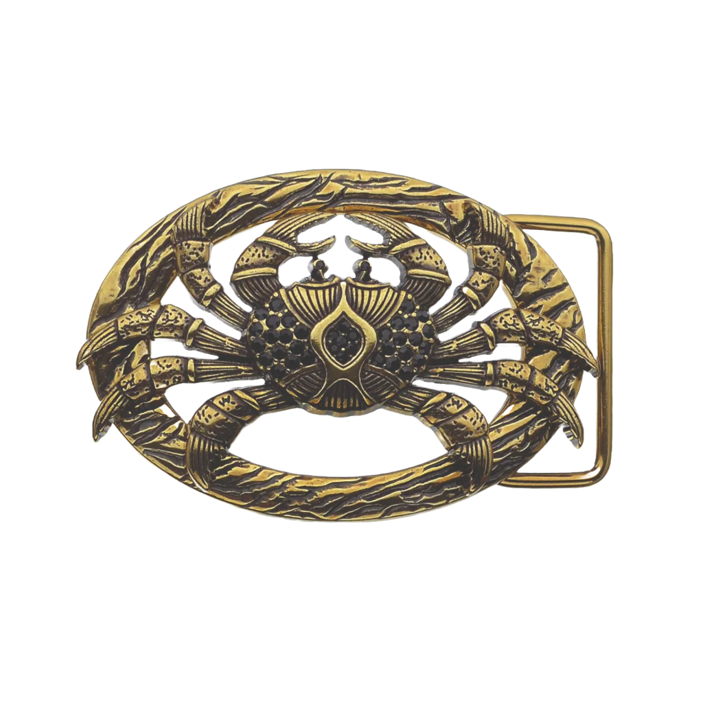 Gold crab-shaped belt buckle on a white background