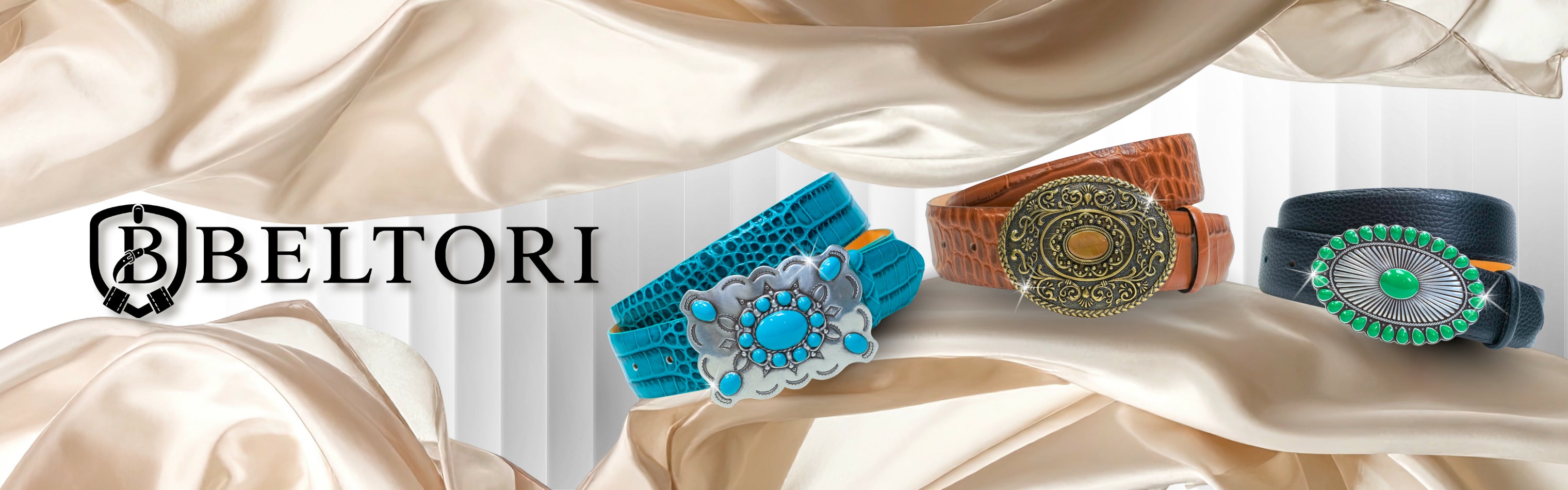Beltori luxury leather belts with ornate turquoise and gold buckles on silk fabric.